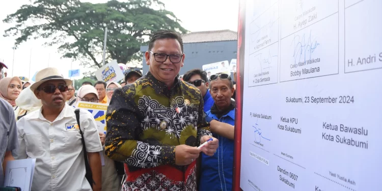 Pj Wali Kota Sukabumi, Kusmana Hartadji, usai menandatangani deklarasi kampanye damai.