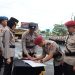 Kapolres Sukabumi Kota, AKBP Rita Suwadi, saat memimpin upacara serah terima jabatan Kasat Reskrim dan Kasat Narkoba di halaman Mapolres Sukabumi Kota, pada Rabu (26/2/2025). Foto: Humas Polres Sukabumi Kota.