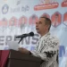 Pj Sekda Kota Sukabumi. M. Hasan Asari, saat memberikan sambutan dalam konferensi PGRI tahun 2025 masa bakti XXII di Gedong Mahoni, Sukabumi, pada Sabtu (22/2/2025). Foto: Dokpim Kota Sukabumi.